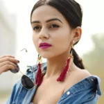 Komal Pandey showcasing a bold fashion look in vibrant colors during a 2025 campaign photoshoot.