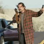 Scene from One Battle After Another showing intense political drama and cinematic visuals.