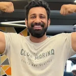 Rajat Dalal lifting heavy weights in gym showcasing strength and muscular physique.