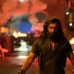 Ranveer Singh intense look in Dhurandhar 2 action scene with dramatic background and high-energy visuals.