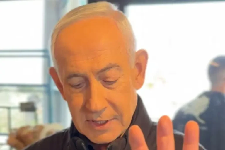 Benjamin Netanyahu holding coffee while addressing viral death rumors in 2026 video.